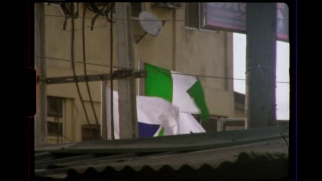 Video Reference: Fixture, Flag, Rectangle, Tints and shades, Display device, Glass, Facade, Event, Font, Shade