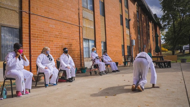 Video Reference: Trousers, Daytime, Temple, Tree, House, Leisure, Hat, Road, City, Street fashion
