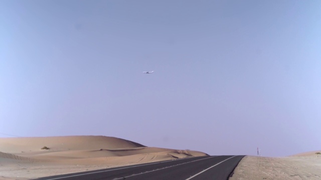 Video Reference: Sky, Ecoregion, Road surface, Asphalt, Plain, Horizon, Landscape, Aeolian landform, Singing sand, Slope