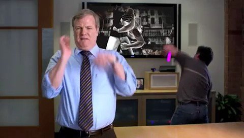 Video Reference: office, man, business attire, foreground, background, screen, desk, indoor, motion, workplace, tie, shirt, meeting room, people, interior, action