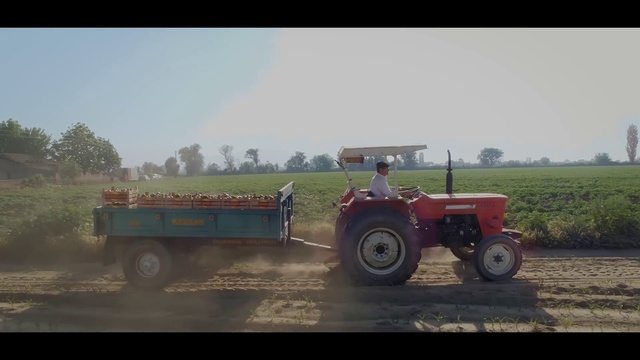 Video Reference: Wheel, Tire, Vehicle, Sky, Tractor, Ecoregion, Motor vehicle, Automotive tire, Plant, Natural environment