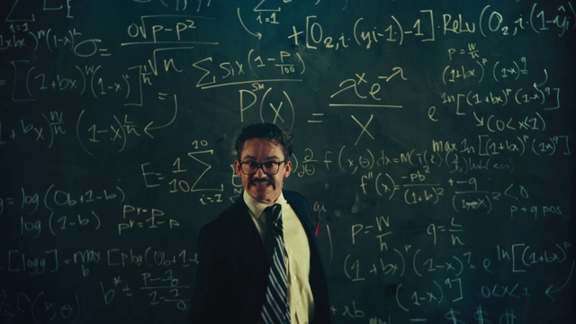 Video Reference: Clothing, Handwriting, Photograph, Human, Black, Tie, Organism, Font, Blackboard, Line