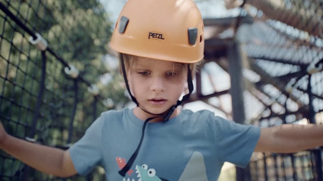 Video Reference: Face, Helmet, Hard hat, Sports gear, Sleeve, Sports equipment, Cap, Happy, Personal protective equipment, Toddler