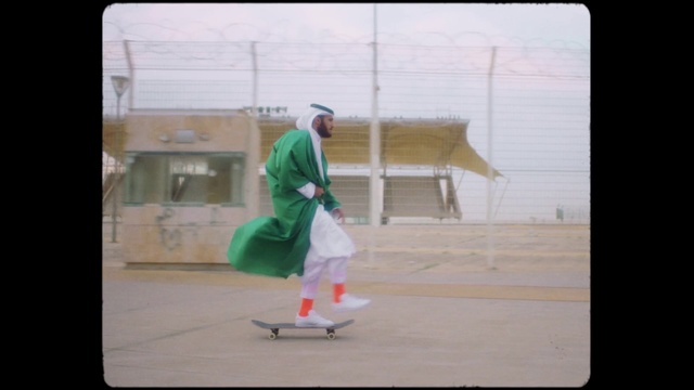 Video Reference: Skateboard truck, Skateboarder, Sports equipment, Sleeve, Rectangle, Rolling, Skateboard, Tints and shades, Window, Display device