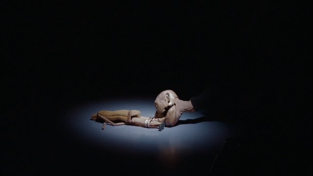 Video Reference: puppet, spotlight, dark scene, theater, stop motion, figure, artistic, surreal, stage, minimalism, black background, object, drama