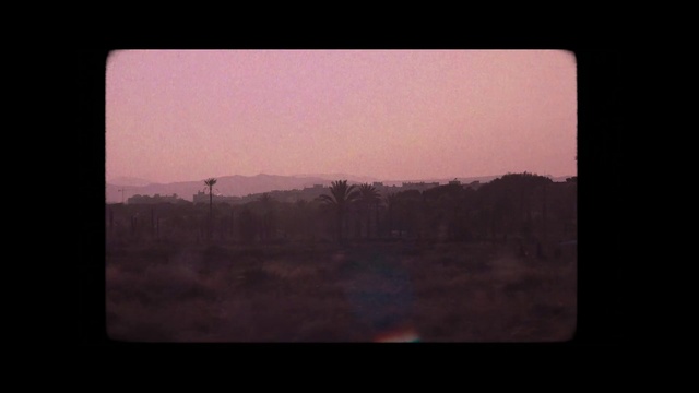 Video Reference: Atmosphere, Sky, Rectangle, Horizon, Landscape, Window, Tints and shades, Natural landscape, Font, Sunset