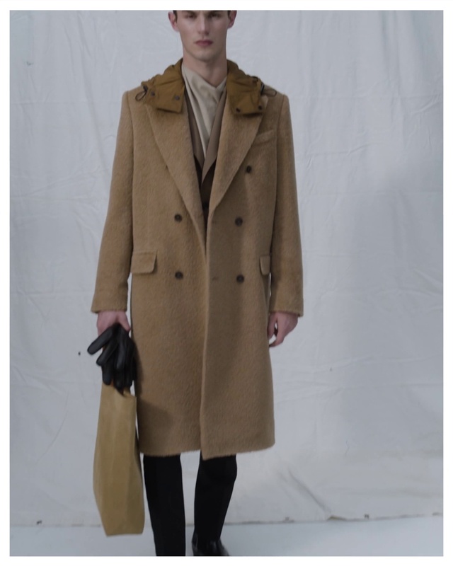 Video Reference: Clothing, Outerwear, Overcoat, Frock coat, Neck, Sleeve, Street fashion, Waist, Hat, Beige