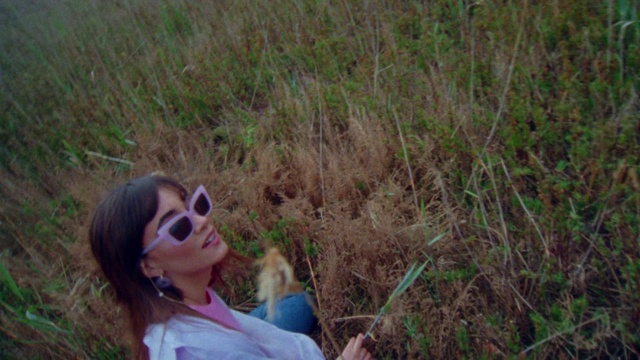 Video Reference: Plant, Goggles, Sunglasses, Smile, Vision care, Happy, Grass, Fawn, People in nature, Grassland