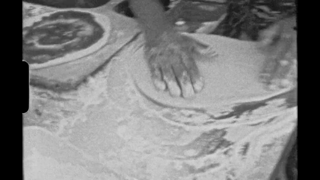 Video Reference: Arm, Human body, Jaw, Gesture, Grey, Style, Black-and-white, Mobile phone, Human leg, Monochrome photography