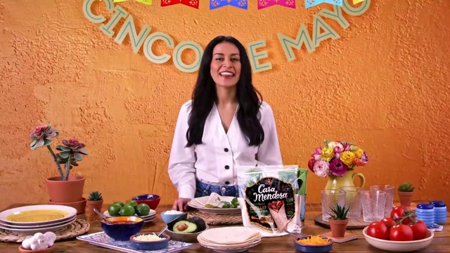 Video Reference: Clothing, Food, Smile, Table, Tableware, Plant, Orange, Dishware, Plate, Flower