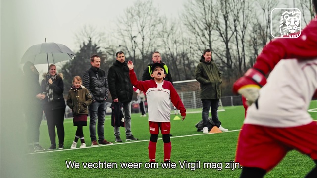 Video Reference: Player, Ball game, Sky, Grass, Tree, Jacket, Sports equipment, Team sport, Umbrella, Sports