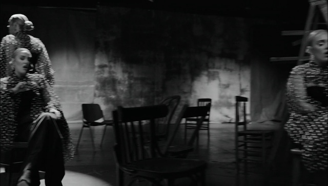 Video Reference: Black, Chair, Flash photography, Black-and-white, Grey, Style, Hat, Entertainment, Tints and shades, Monochrome