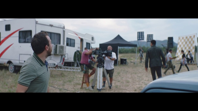 Video Reference: Shorts, Cloud, Sky, Motor vehicle, Vehicle, Natural environment, Tire, Style, Tent, Crowd