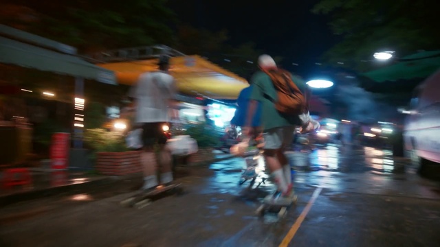 Video Reference: Shorts, Automotive lighting, Road surface, Asphalt, Thigh, Road, City, Midnight, Sidewalk, Human leg