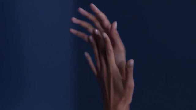 Video Reference: Gesture, Finger, Thumb, Wrist, Nail, Electric blue, Eyelash, Sign language, Flesh, Darkness