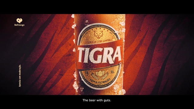 Video Reference: Bottle, Amber, Font, Drink, Alcoholic beverage, Glass bottle, Wood, Tints and shades, Emblem, Beer