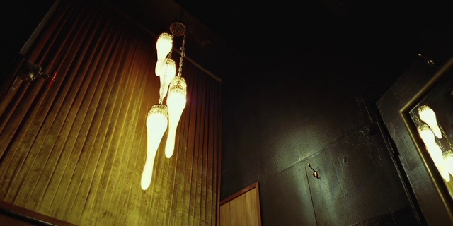 Video Reference: Amber, Wood, Electricity, Tints and shades, Light bulb, Ceiling, Darkness, Facial hair, Compact fluorescent lamp, Light fixture