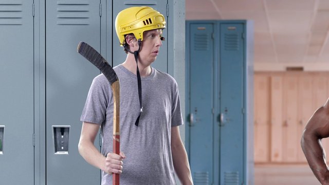 Video Reference: locker room, hockey, helmet, player, sports, stick, indoor, school, uniform, athlete, team, equipment