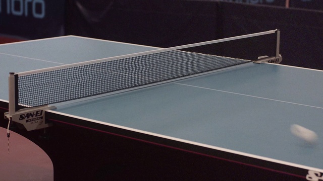 Video Reference: Racquet sport, Table, Sports equipment, Rectangle, Ping pong, Wood, Tennis, Floor, Ball game, Material property