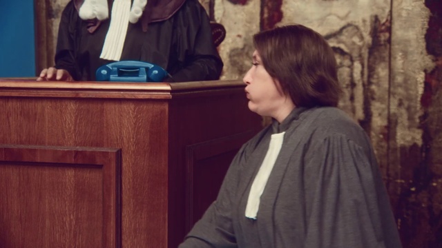 Video Reference: Coat, Standing, Wood, Event, Microphone, Formal wear, Electric blue, Sitting, Conversation, Speaker