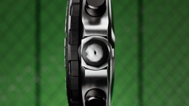 Video Reference: close-up, mechanical, metal, wheel, device, industrial, abstract, green background, macro, hardware, machinery, side view