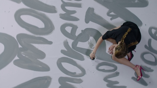 Video Reference: Leg, Font, Art, Hat, Flooring, Fashion design, Pattern, Event, Design, T-shirt