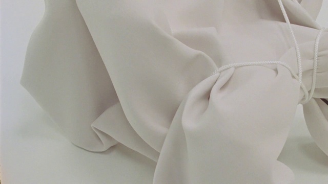 Video Reference: Neck, Petal, Gesture, Collar, Comfort, Fashion accessory, Formal wear, Linens, Wedding ceremony supply, Peach