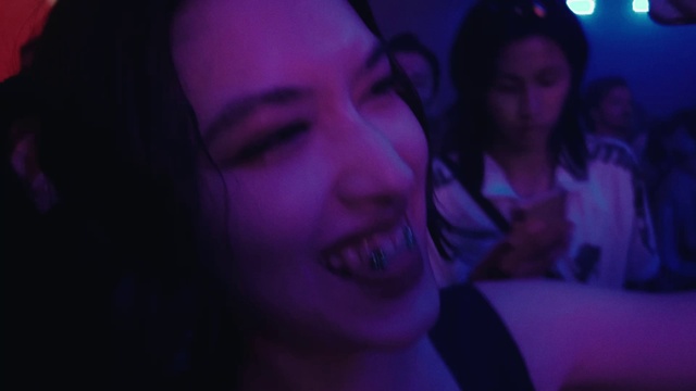 Video Reference: Nose, Lip, Smile, Mouth, Eyebrow, Facial expression, Purple, Eyelash, Flash photography, Ear