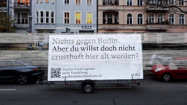 Video Reference: Tire, Wheel, Building, Vehicle, Window, White, Motor vehicle, Font, Car, Automotive exterior