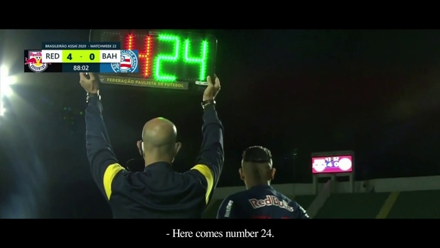 Video Reference: Gesture, T-shirt, Font, Gadget, Display device, Technology, Recreation, Electronic device, Television, Competition event