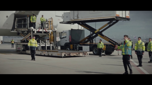 Video Reference: Workwear, High-visibility clothing, Infrastructure, Asphalt, Road surface, Truck, Hard hat, Motor vehicle, Gas, Engineering