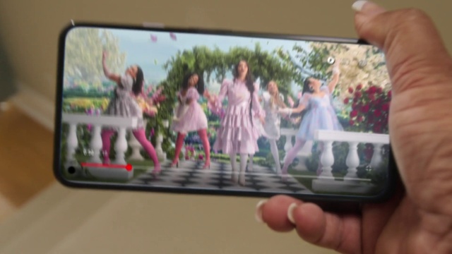Video Reference: Hand, Plant, Output device, Dress, Gesture, Computer, Pink, Tablet computer, Finger, Gadget