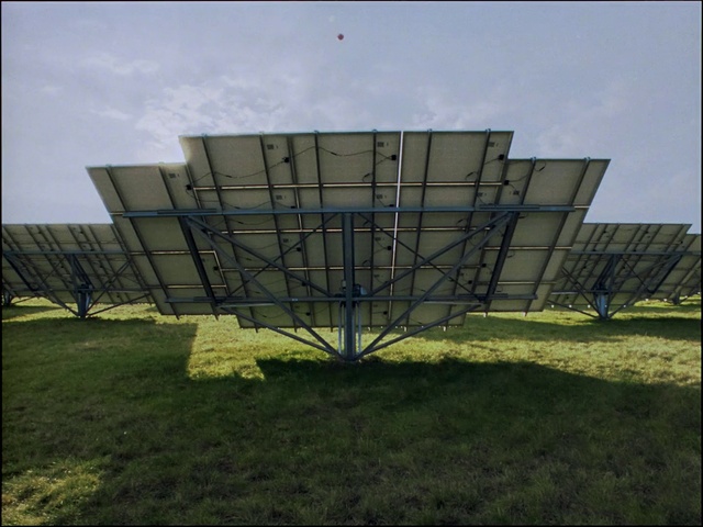 Video Reference: Sky, Cloud, Building, Plant, Shade, House, Grass, Rectangle, Urban design, Natural landscape