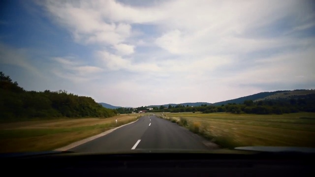 Video Reference: Sky, Cloud, Plant, Ecoregion, Natural landscape, Natural environment, Road surface, Asphalt, Sunlight, Tar