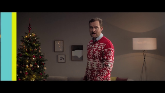 Video Reference: Christmas tree, Christmas ornament, Sleeve, Flash photography, Standing, Holiday ornament, Ornament, Evergreen, Picture frame, T-shirt