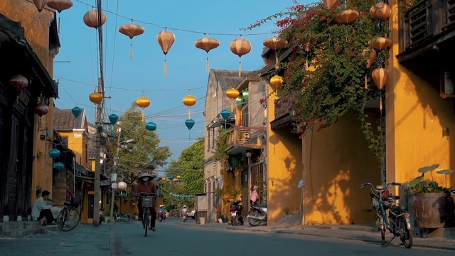 Video Reference: Tire, Wheel, Sky, Daytime, Photograph, Building, Light, Infrastructure, Road surface, Orange