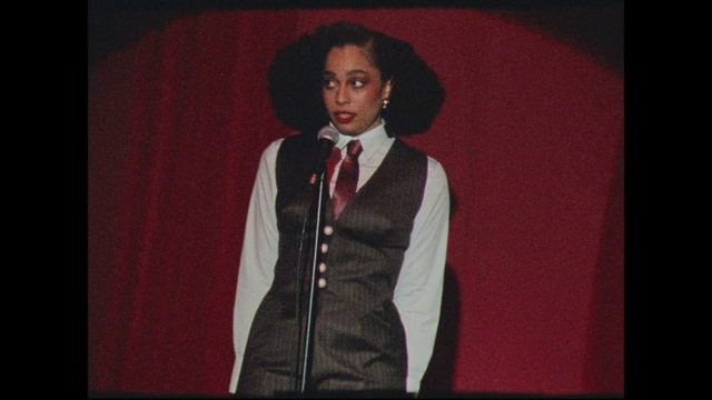 Video Reference: Dress shirt, Sleeve, Hat, Entertainment, Collar, Flash photography, Performing arts, Blazer, Formal wear, Fashion design