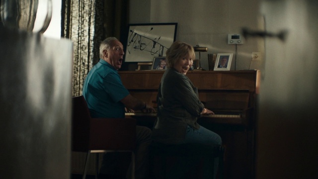 Video Reference: Picture frame, Standing, Curtain, Clock, Event, Room, T-shirt, Sitting, Job, White-collar worker