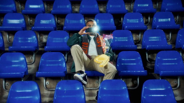 Video Reference: Furniture, Chair, Blue, Light, Red, People, Electric blue, Leisure, Event, Audience