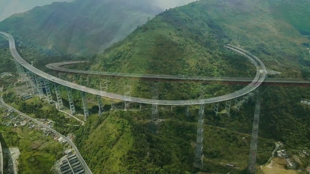 Video Reference: Mountain, Infrastructure, Sky, Tree, Natural landscape, Plant, Atmospheric phenomenon, Thoroughfare, Bridge, Landscape