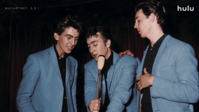 Video Reference: Microphone, Outerwear, Shirt, Dress shirt, Coat, Gesture, Flash photography, Jacket, Blazer, Entertainment