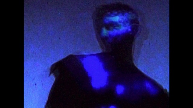 Video Reference: Electric blue, Chest, Darkness, Barechested, Event, Rectangle, Shadow, Flesh, Room, Flash photography