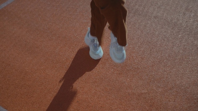 Video Reference: Leg, Human body, Wood, Road surface, Flooring, Hardwood, Tints and shades, Sneakers, Asphalt, Knee