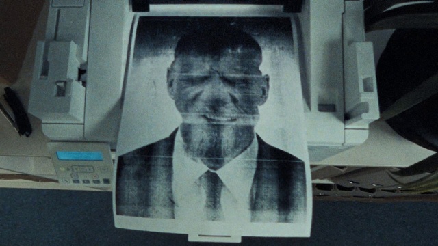 Video Reference: Forehead, Suit, Tie, Art, Font, White-collar worker, Monochrome photography, Display device, Monochrome, Television set