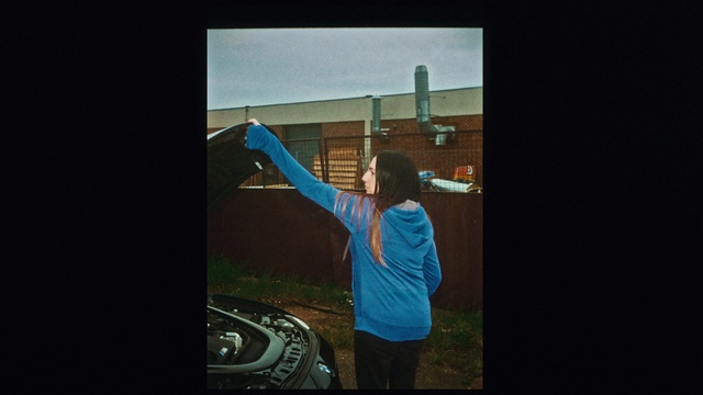 Video Reference: Flash photography, Gesture, Tints and shades, Font, Electric blue, Space, Darkness, Door, Elbow, T-shirt