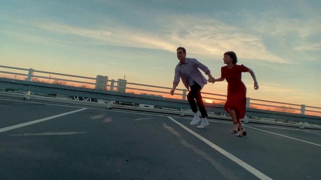 Video Reference: Cloud, Sky, Shorts, Asphalt, Sports equipment, Rolling, Athlete, Landscape, Sports, Recreation