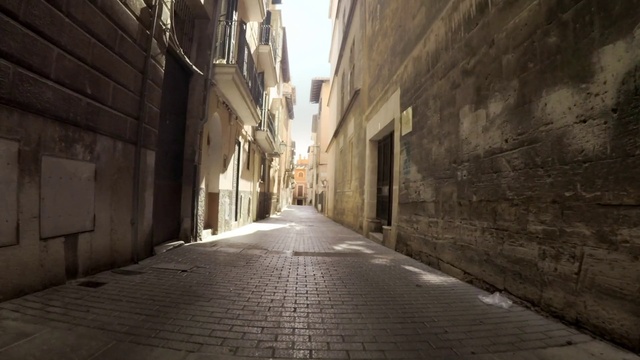 Video Reference: Road surface, Wood, Building, Flooring, Window, Neighbourhood, Thoroughfare, Alley, City, Tints and shades