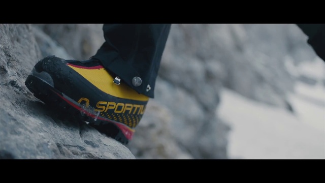 Video Reference: Grey, Asphalt, Font, Walking shoe, Human leg, Flooring, Recreation, Outdoor shoe, Athletic shoe, Personal protective equipment