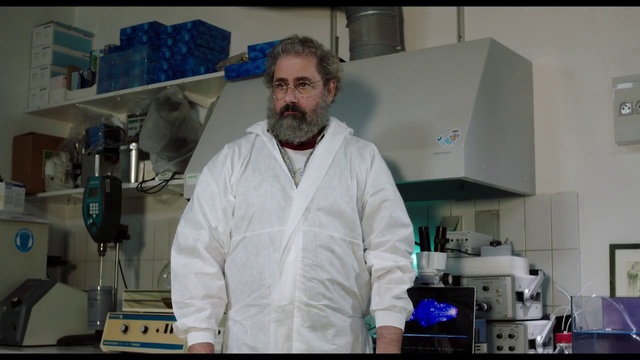 Video Reference: Scientist, Dress shirt, Safety glove, Researcher, Workwear, Research, Laboratory, Sleeve, White coat, Laboratory equipment