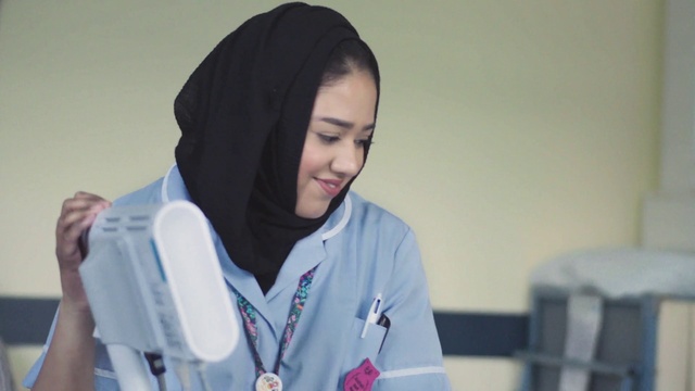 Video Reference: Smile, Sleeve, Street fashion, Jacket, Collar, Electric blue, Event, Science, Uniform, Job